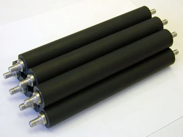 Smooth rubber rollers reduce friction during material movement Smooth rubber rollers reduce friction during material movement
